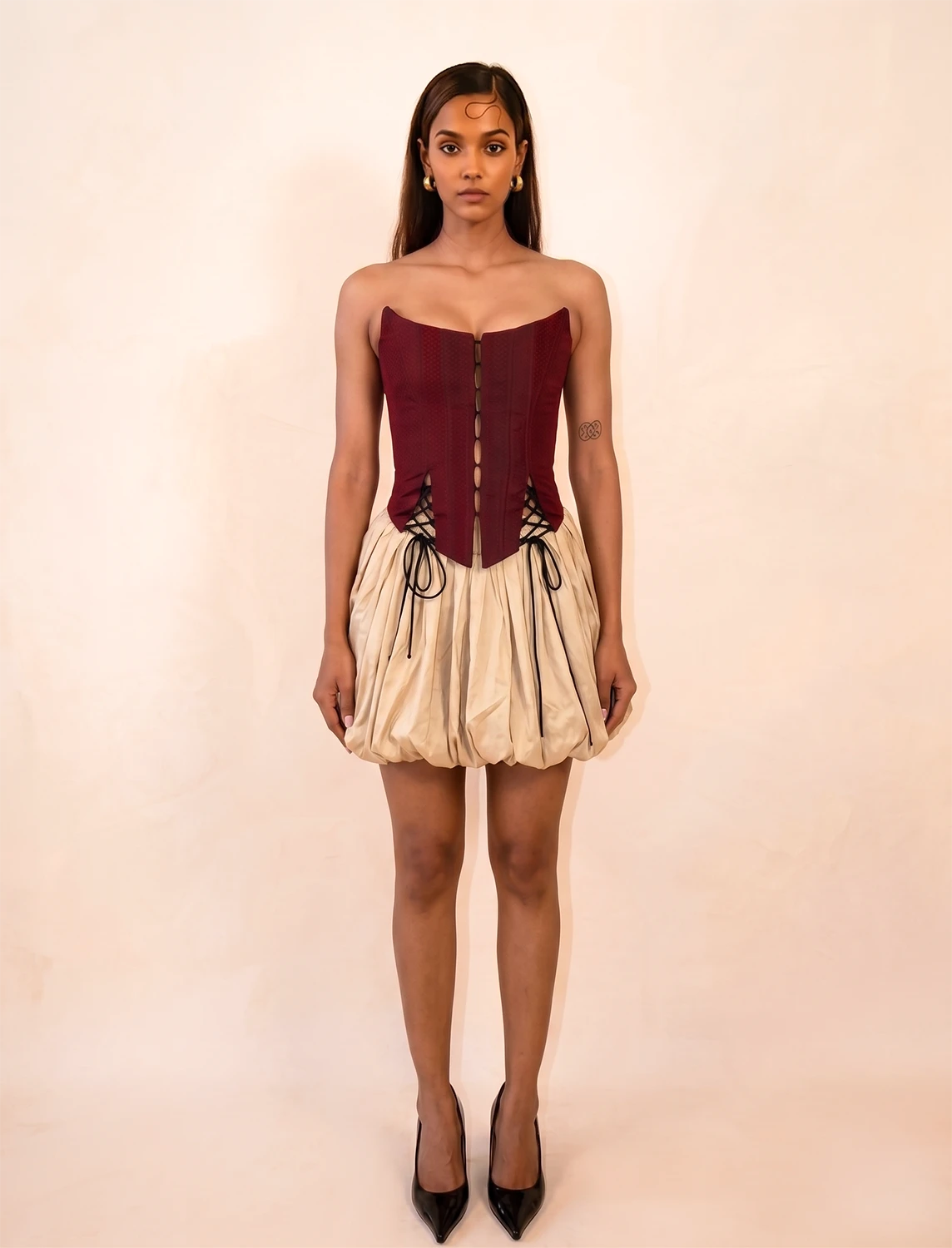 four-panel corset crafted from a vintage Maroon silk sari, featuring V-cut detailing and adjustable lace-up panels, consciously handcrafted by Bodements to celebrate heritage, craft, and mindful fashion.