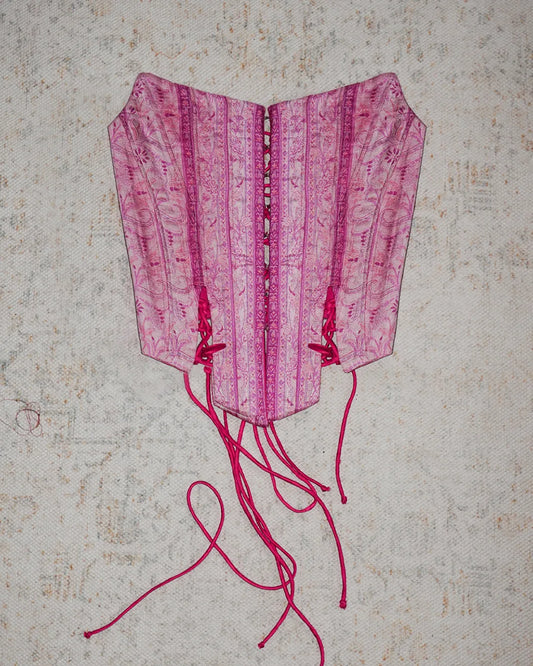four-panel corset crafted from a vintage Pink silk sari, featuring V-cut detailing and adjustable lace-up panels, consciously handcrafted by Bodements to celebrate heritage, craft, and mindful fashion.