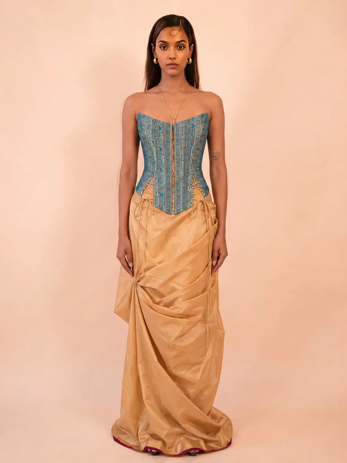 RAINA is our one-of-a-kind four-panel corset, handcrafted in-house using a vintage silk saree.