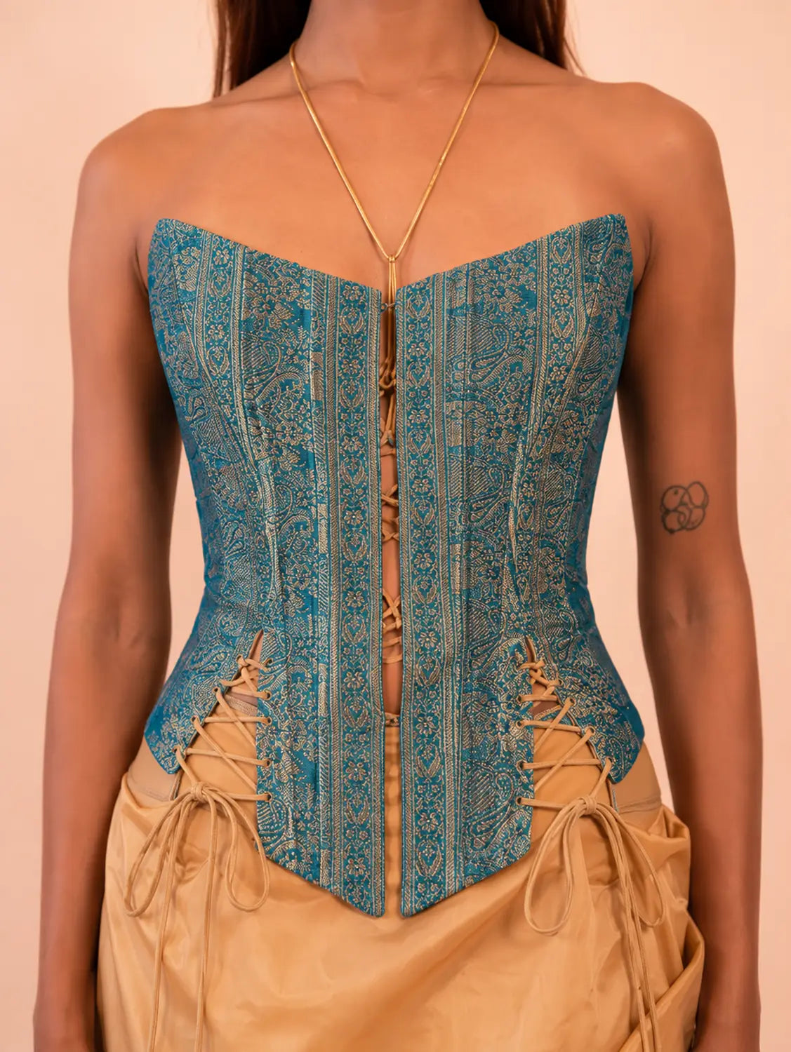 RAINA is our one-of-a-kind four-panel corset, handcrafted in-house using a vintage silk saree.