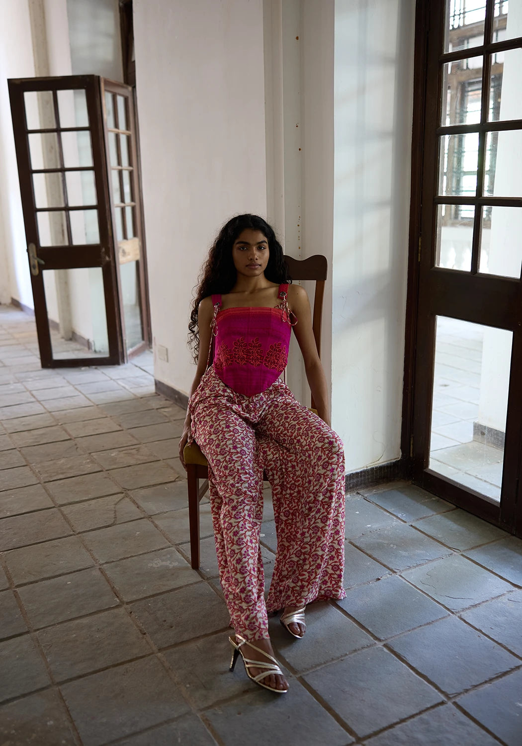 RAYA is our one-of-a-kind printed silk corset with delicate shoulder straps, handcrafted by skilled artisans in-house using a vintage silk saree. 