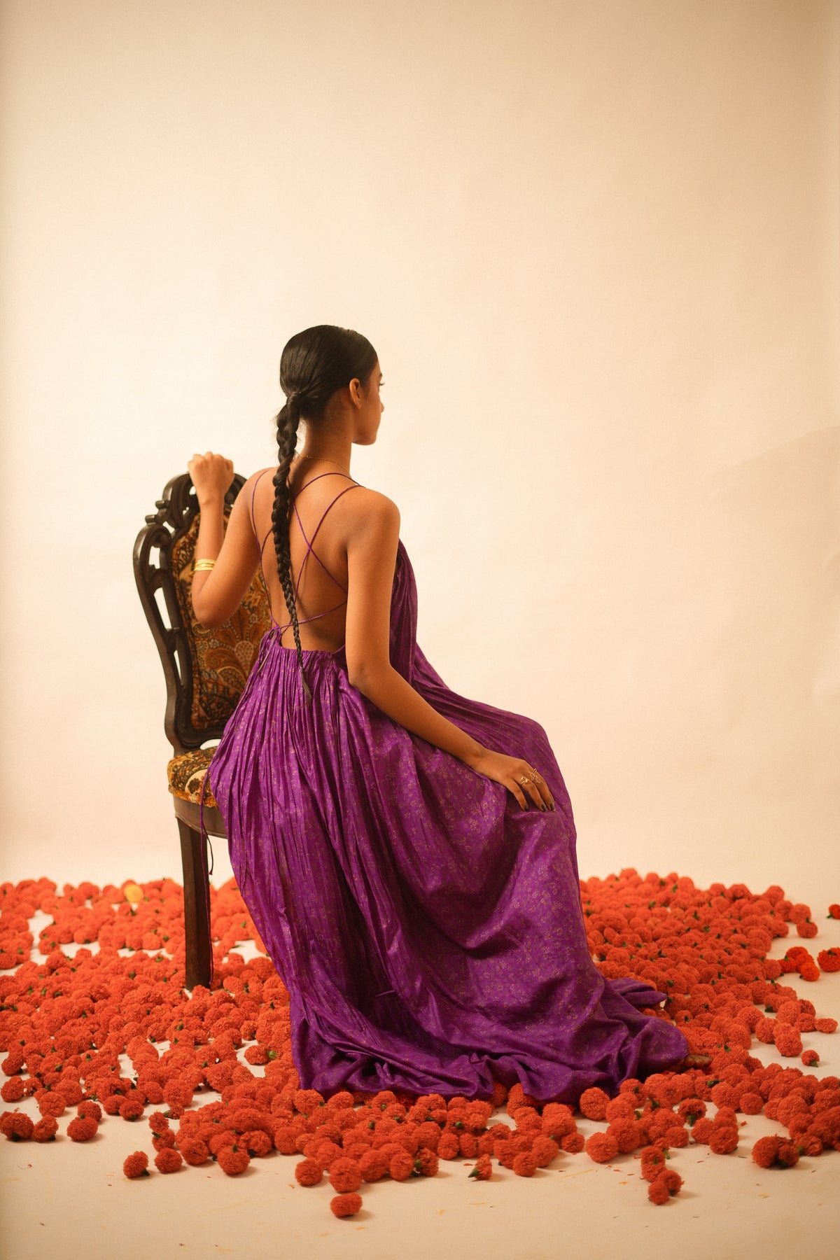 SAHIBA is our one-of-a-kind deep V backless dori dress, handcrafted by skilled artisans in-house using a one-of-a-kind vintage silk saree. 