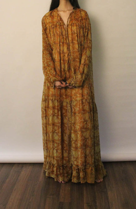 SAIA vintage silk maxi dress in black with beige floral motifs, flowy silhouette, versatile deep V or tied neckline, and elastic cuff long sleeves.