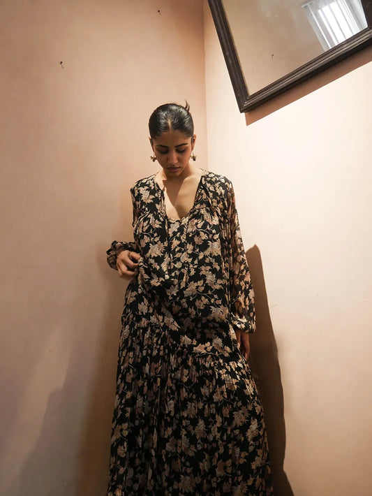 SAIA, our one-of-a-kind maxi dress made in-house using a vintage silk saree. This garment features a flowy silhouette with a versatile neckline that can be worn deep V or tied with delicate strings for a closed, modest look