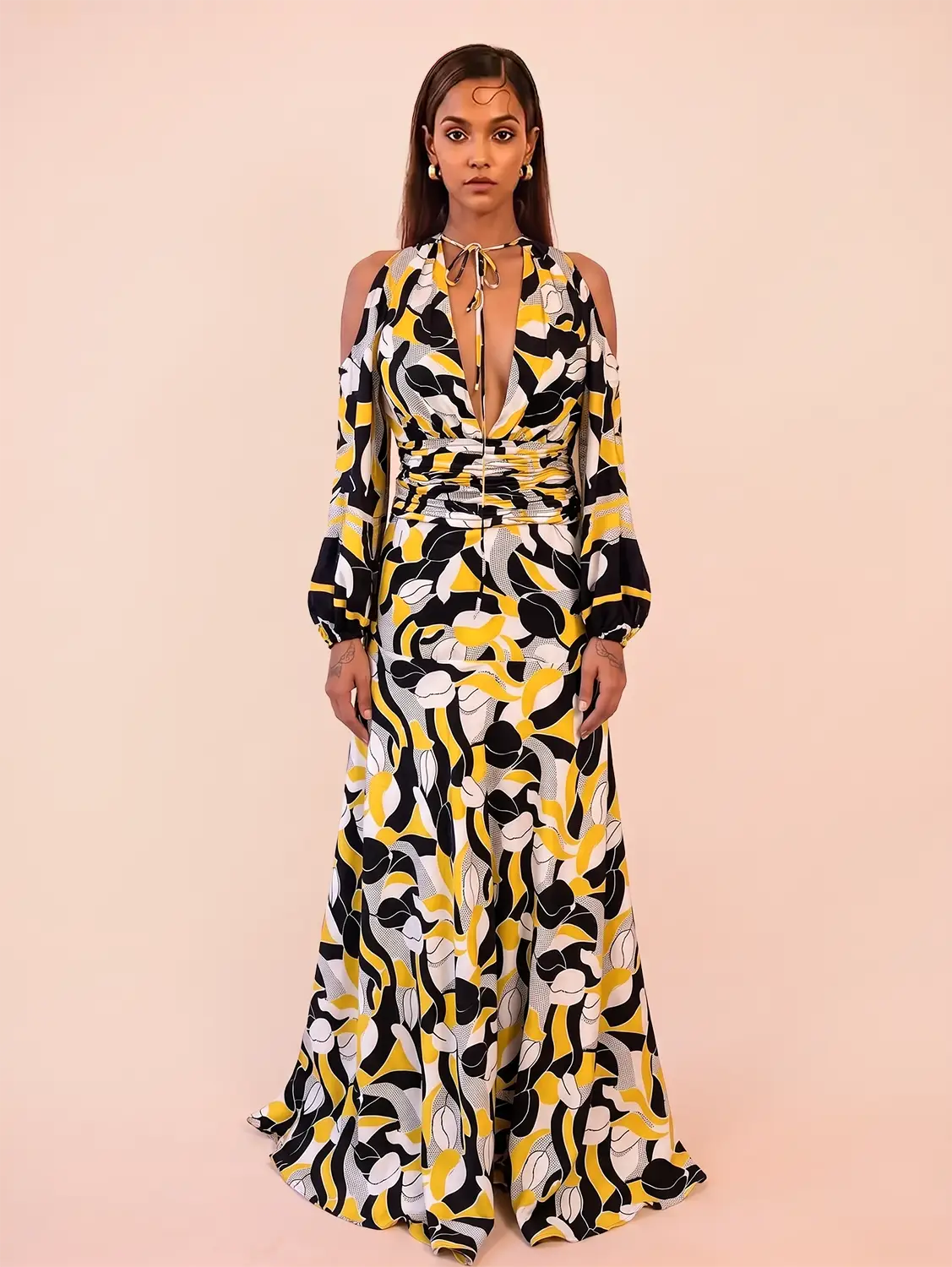 TAARA III Dress is a one of a kind piece, handcrafted in house from pure silk. Designed with a deep V neckline and button down front, it features a fitted waist that shapes the body. 
