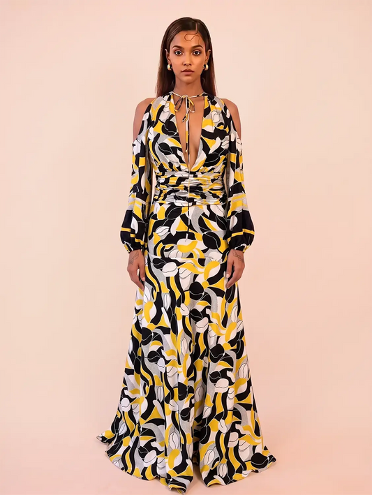 TAARA III Dress is a one of a kind piece, handcrafted in house from pure silk. Designed with a deep V neckline and button down front, it features a fitted waist that shapes the body. 