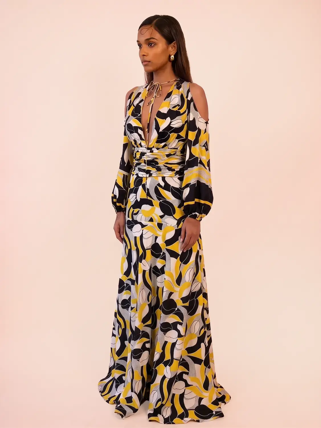 TAARA III Dress is a one of a kind piece, handcrafted in house from pure silk. Designed with a deep V neckline and button down front, it features a fitted waist that shapes the body. 