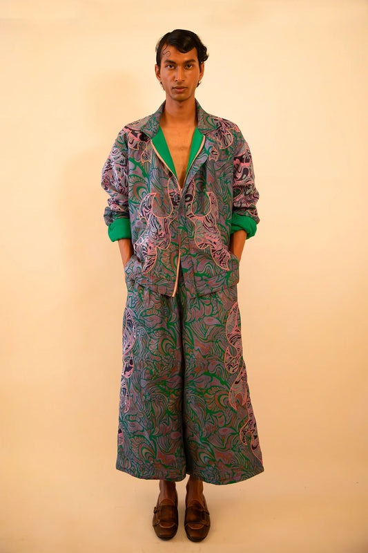 Unisex patchwork bomber and wide-leg pant set made from vintage textiles, featuring dragon motifs, green lining, and two-way zip