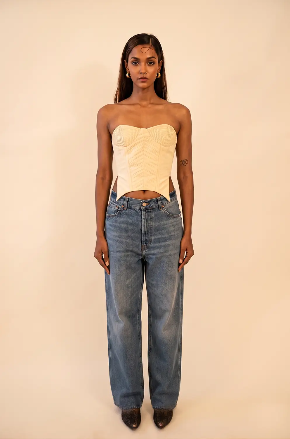 Off-white strapless corset featuring cording detail, handcrafted from upcycled vintage fabric, designed for a structured fit and conscious style