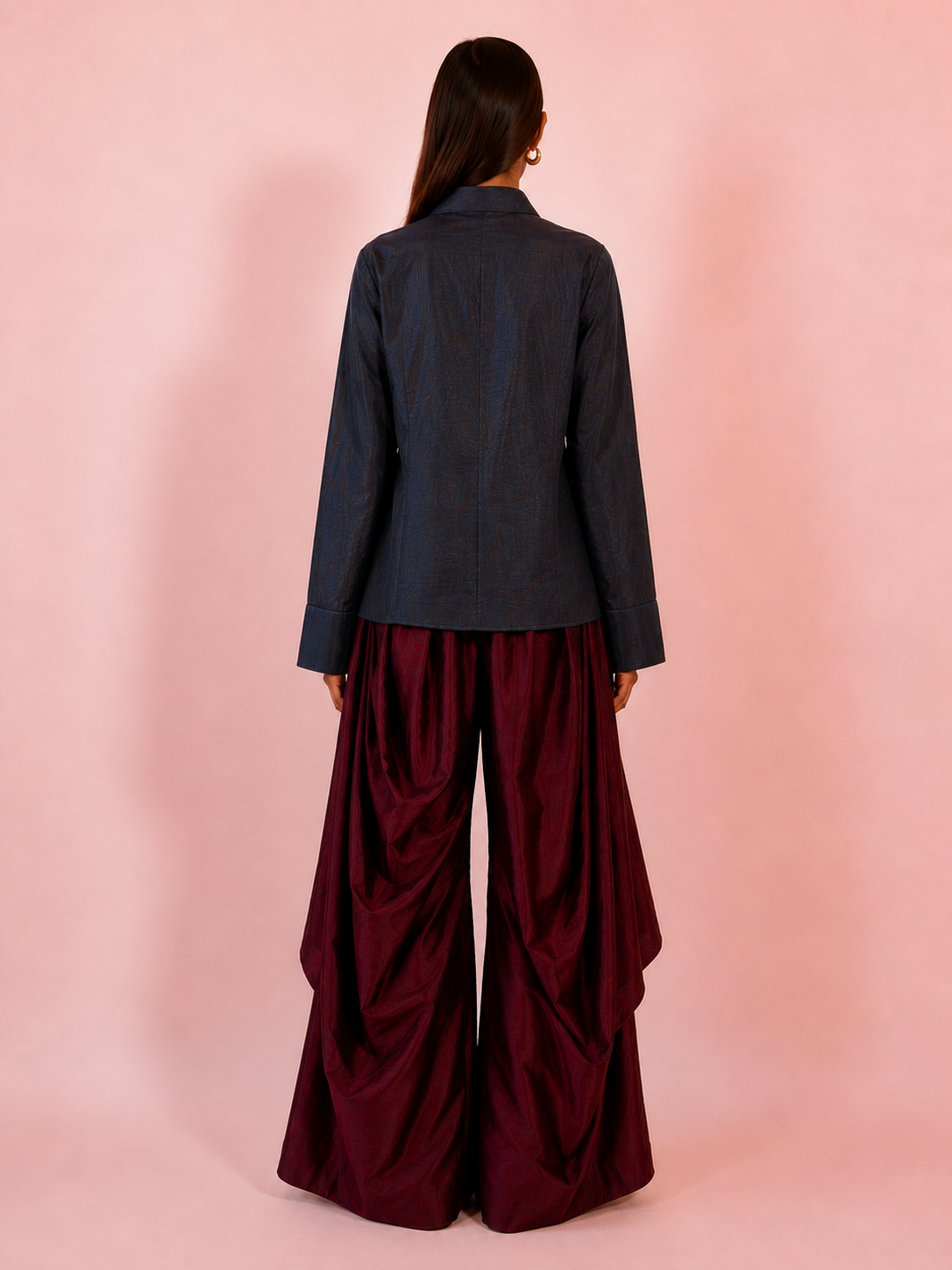 VASTRAM is our one-of-a-kind loose-fitting outer tunic, handcrafted in-house with a layered, asymmetrical fall and patched full sleeves.