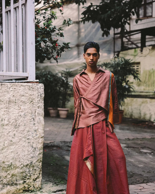 Vastram asymmetrical tunic with patch sleeves paired with Pancha drape skirt featuring bordered hem.