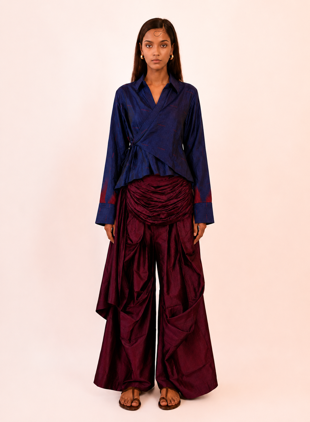 VASTRAM II is our one-of-a-kind loose-fitting outer tunic, handcrafted in-house with a layered, asymmetrical fall and patched full sleeves. 