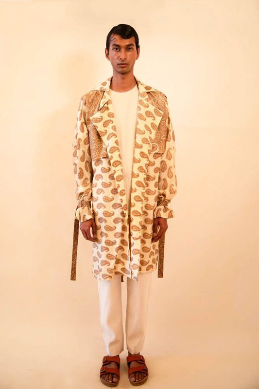 Vedya is our one-of-a-kind beige paisley silk trench coat, handcrafted by skilled artisans in-house using a vintage silk sari.