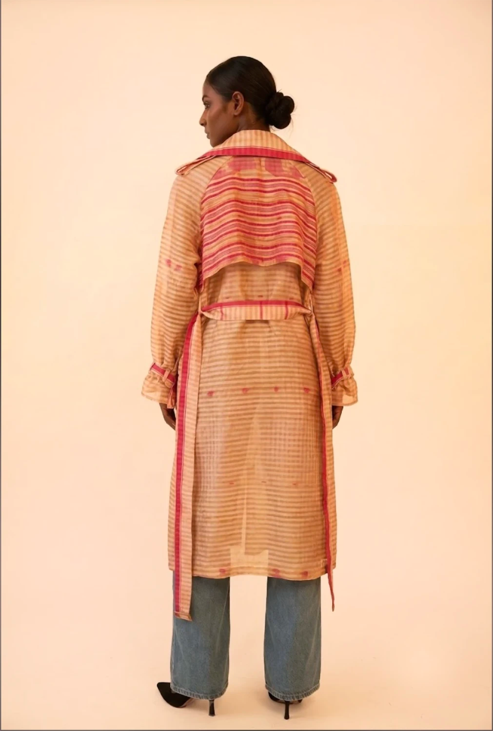 VEDYA IX is our one-of-a-kind pink and white silk trench coat, handcrafted in-house using a vintage silk saree. 