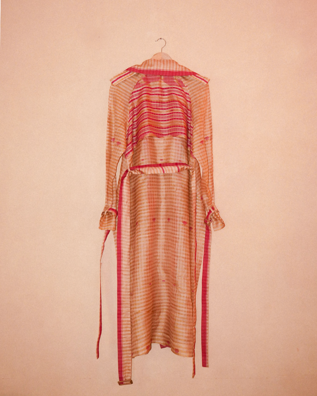 VEDYA IX is our one-of-a-kind pink and white silk trench coat, handcrafted in-house using a vintage silk saree. 