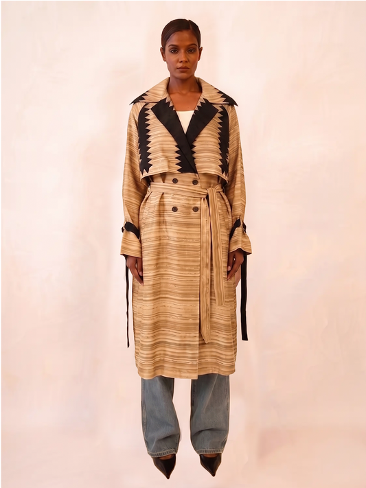 VEDYA XII is our one-of-a-kind beige paisley silk trench coat, handcrafted in-house using a vintage silk saree. 