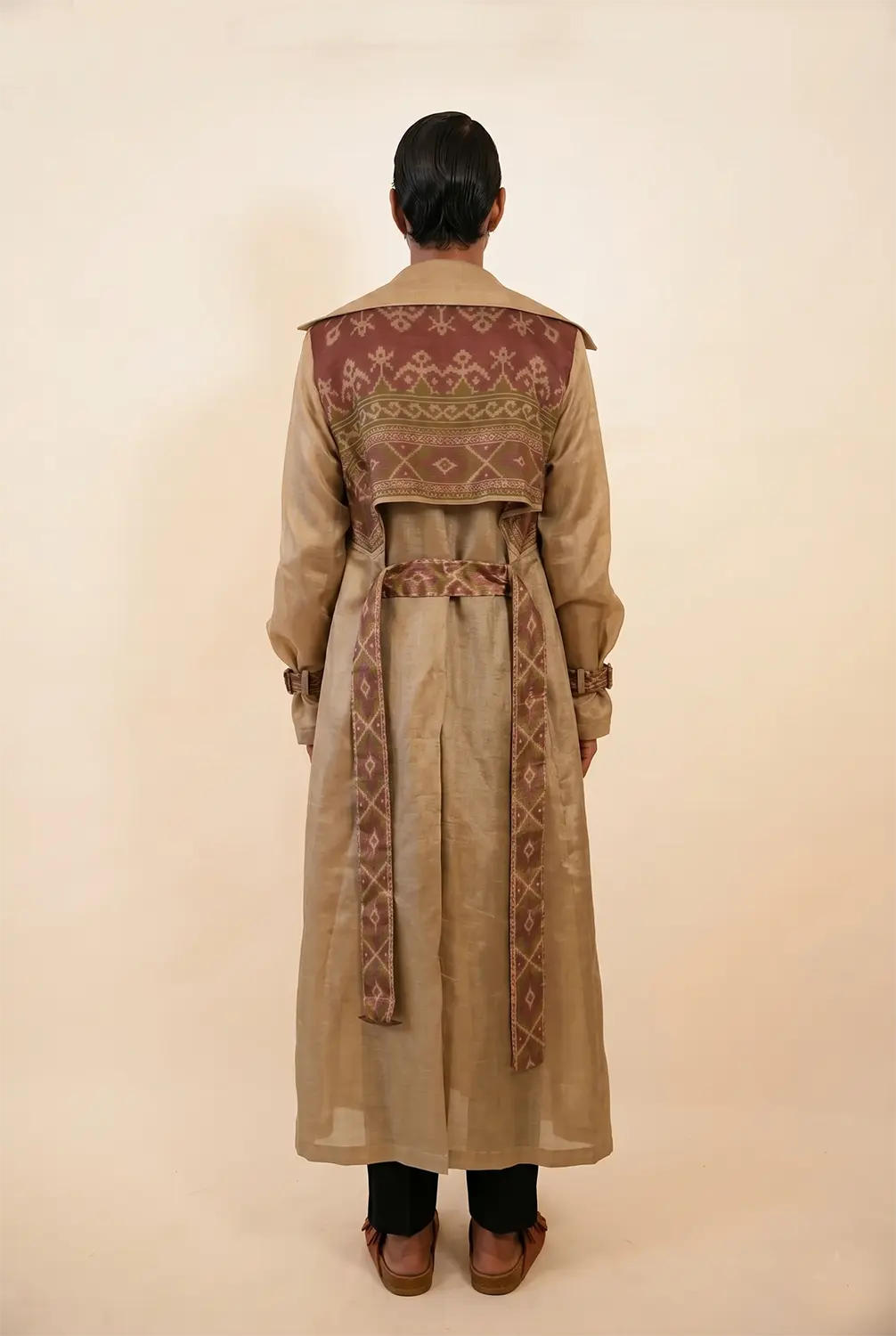 Vedya is our one-of-a-kind off-white silk trench coat, handcrafted by skilled artisans in-house using a one-of-a-kind vintage silk saree.