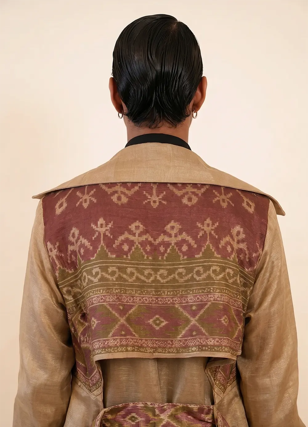 Vedya is our one-of-a-kind off-white silk trench coat, handcrafted by skilled artisans in-house using a one-of-a-kind vintage silk saree.