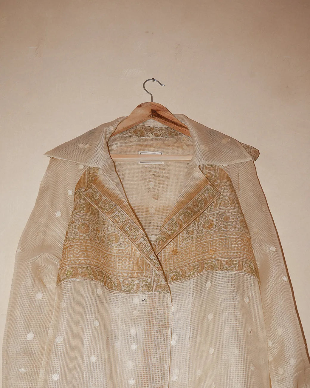 Vedyawhite checkered silk trench coat handcrafted from  silk with relaxed boxy fit, buckle details on arms and waist