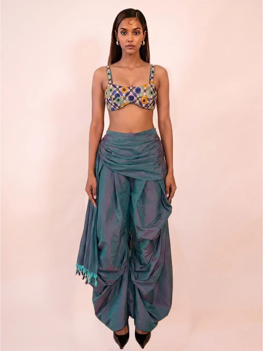 Vyom is our intricately embroidered bralette-style blouse, crafted in house using the leftover fabric of our Chola jacket.