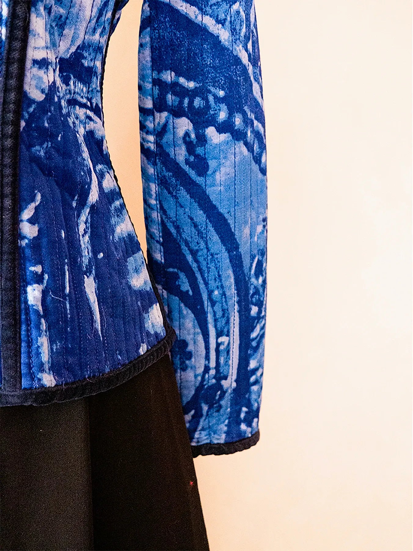 Vintage Gattinoni blue quilted jacket featuring contrast piping and structured tailoring, sourced from global designer archives.