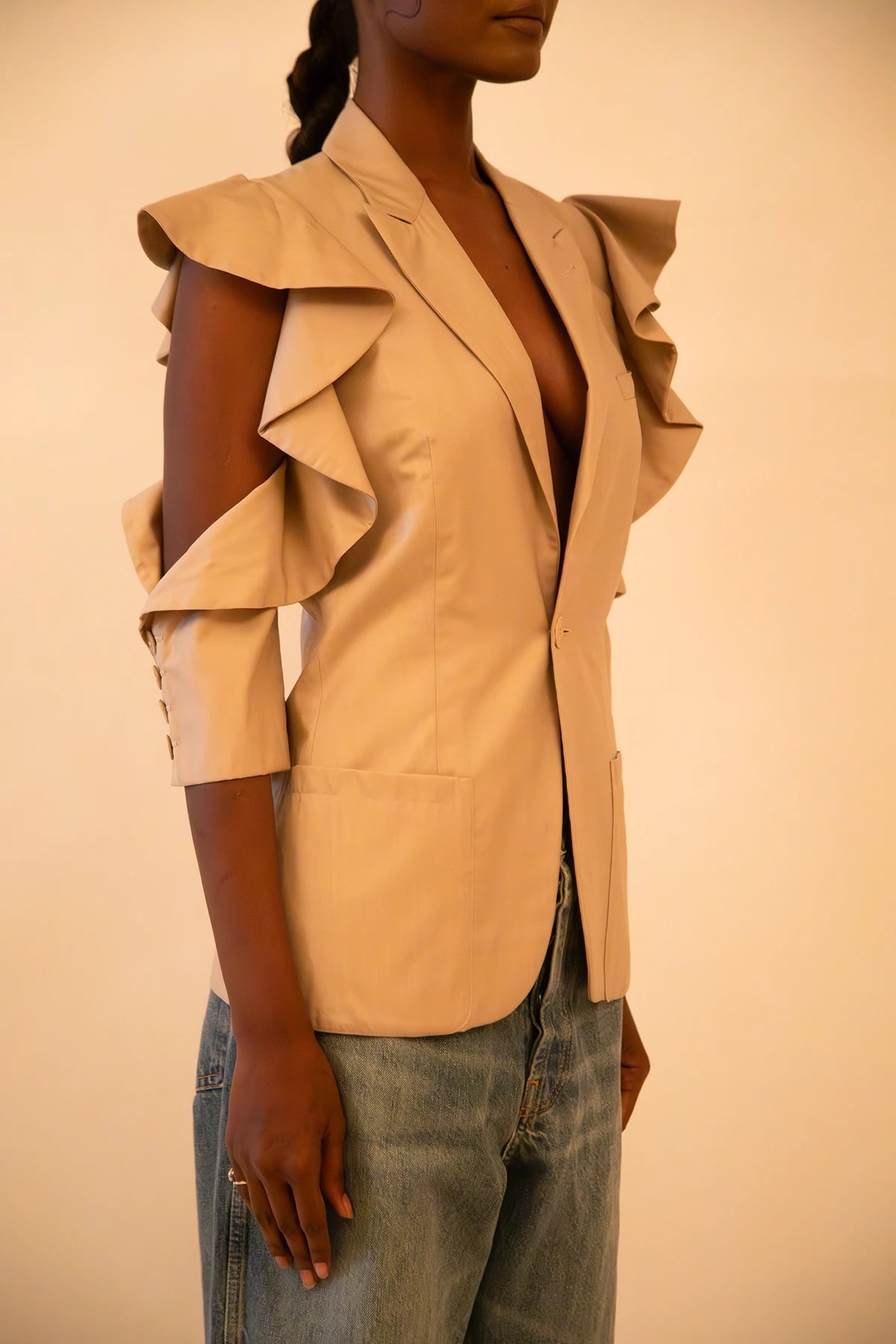 Vintage Jean Paul Gaultier fitted blazer with ruffle detailing and open shoulders, featuring sculpted tailoring and iconic archival design