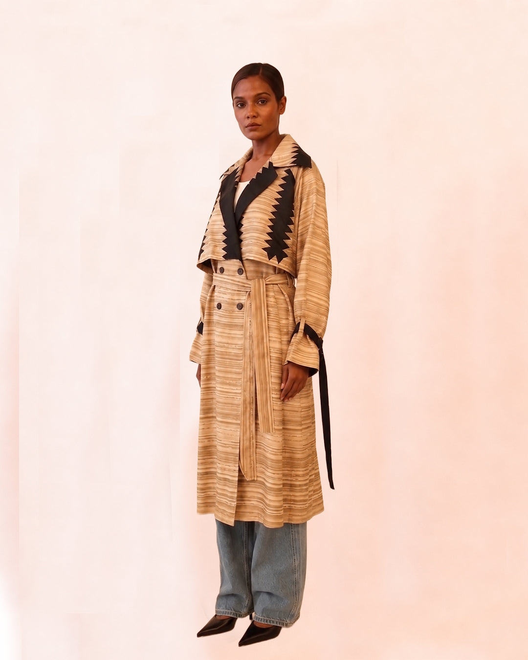 VEDYA XII is our one-of-a-kind beige paisley silk trench coat, handcrafted in-house using a vintage silk saree. 