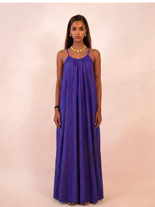 ZOYA is a one-of-a-kind slip dress handcrafted from a vintage silk saree, reimagined into something light, fluid, and enduring.